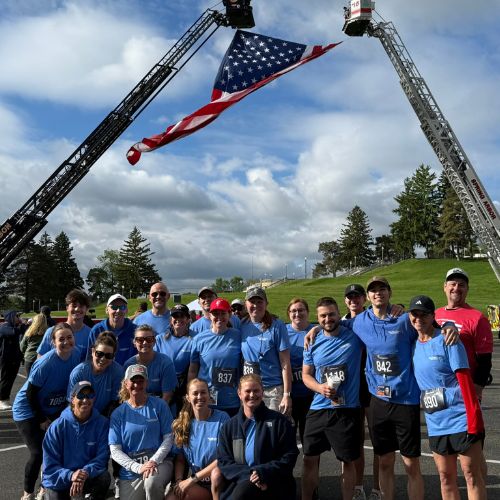 Ann Arbor team in front of American flag at T2T